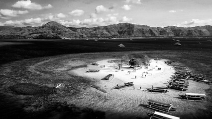 Aerial drone view Gili Kedis Lombok Indonesia on sunny afternoon with white sand beach turquoise waters and tropical island paradise © jovannig