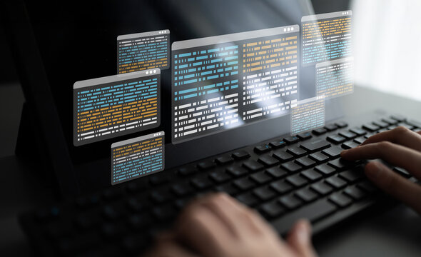 A close-up view of hands typing on a keyboard with multiple coding windows suspended above, showcasing a blend of technology and programming in a modern work environment. Ledger