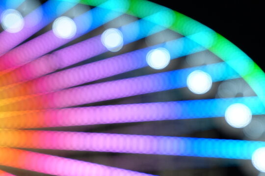 Abstract background lights of a ferris wheel at the fair
