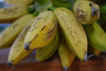 Close up of ripe bananas on a stock © GrantSmithCamera