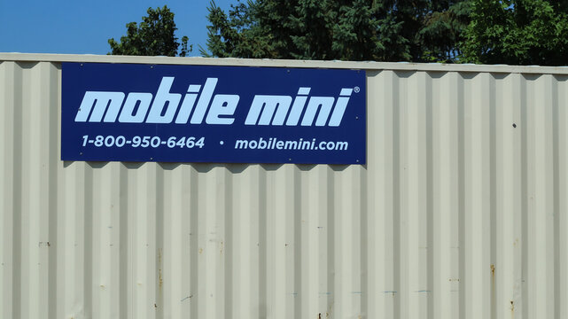A Mobile Mini storage unit featuring their logo on a blue sign (Minnesota, USA - July 26, 2026). Editorial Use Only.