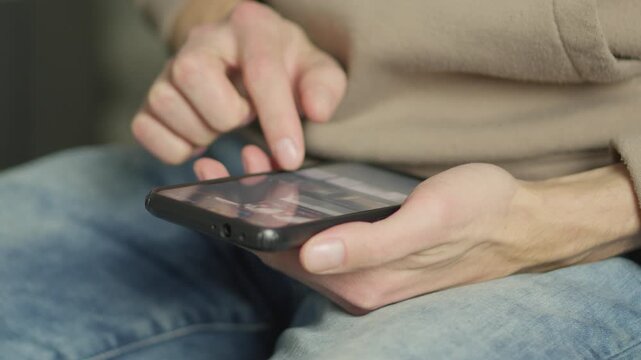 A person in casual clothing navigates a tablet with their fingers, highlighting everyday digital interaction. The image captures the essence of connectivity and contemporary tech habits