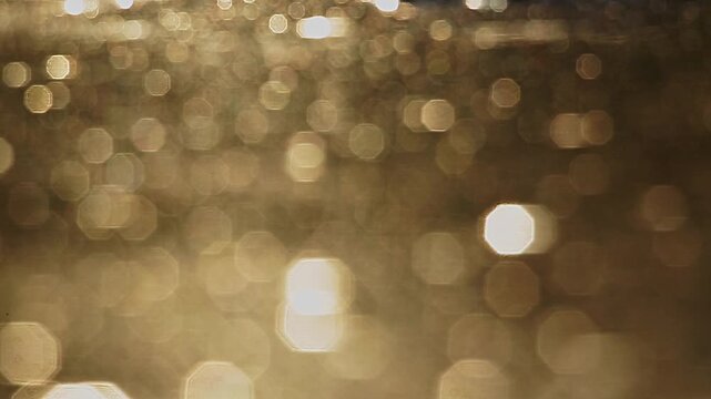 Reflection of sunset in water for natural background with glow and glitter