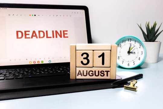 Deadline Concept with Laptop Calendar Clock and August 31 Date