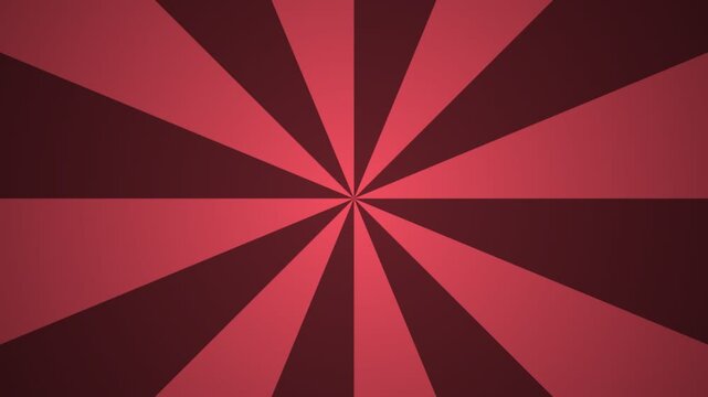 Red sunburst rays rotating in a retro pattern