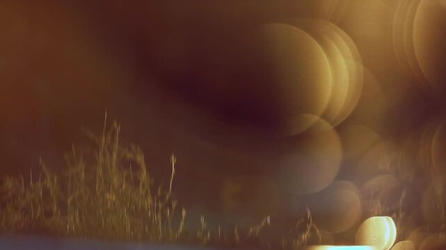 Reflection of sunset in water for natural background with glow and glitter