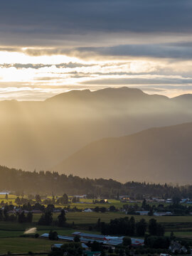 Sunrise Over Misty Chilliwack Valley With Mountains and Farmland in British Columbia, Canada