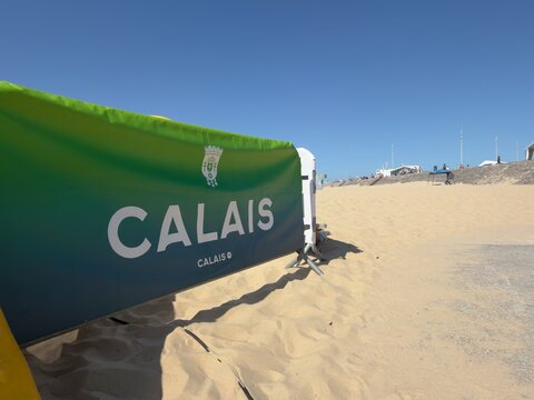 Calais beach with Calais sign