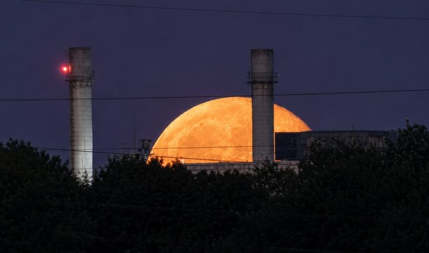 Moonrise Between Industrial Chimneys