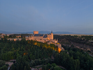 Obraz premium Segovia, spain; 07 25 2026 alcazar of segovia castle illuminated at twilight in spain