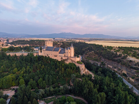Segovia, spain; 07 25 2026 alc&aacute;zar of segovia castle at sunset aerial view