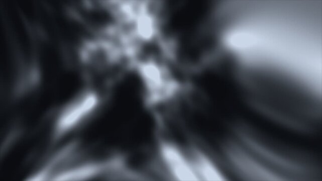 Abstract background with glowing white light streaks and dark blurred motion effects