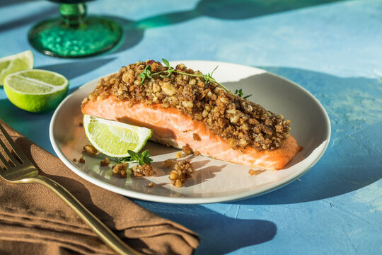 Baked salmon with lemon bread crust and fresh vegetable salad