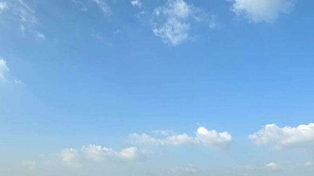 Cloudscape, Timelapse of Minimal Blue Sky Background with Low Clouds and Copy Space for Banner and Template
