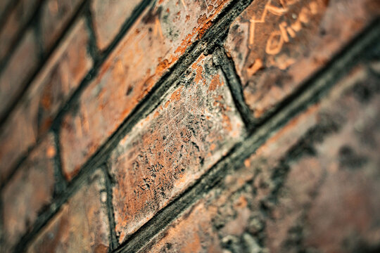 Historic Red Brick Wall with Carved Inscriptions in St Petri Tower Hamburg