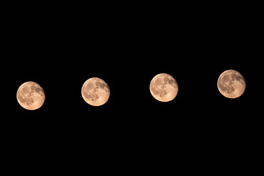 Beautiful night sky composition featuring the complete lunar cycle, capturing the changing phases of the Moon in a single panoramic view.