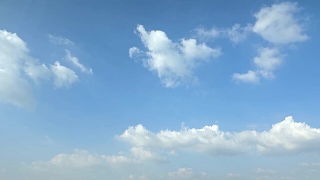 Cloudscape, Timelapse of Blue Sky Background with Fluffy Cumulus Clouds and Open Space for Wallpaper and Banner