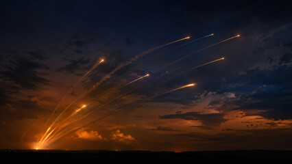 Obraz premium Multiple Missile Launches Across Night Sky During Military Attack