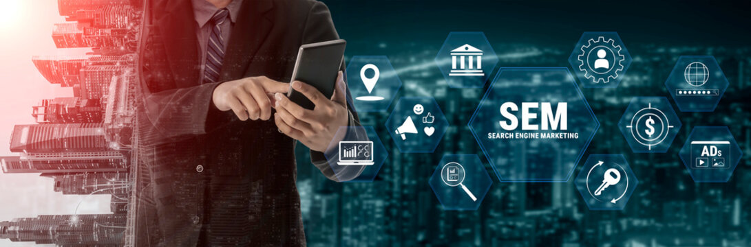 Businessman Using Smartphone with SEM Icons Overlaid on Cityscape Background in Modern Digital Marketing Concept. Glyphic.