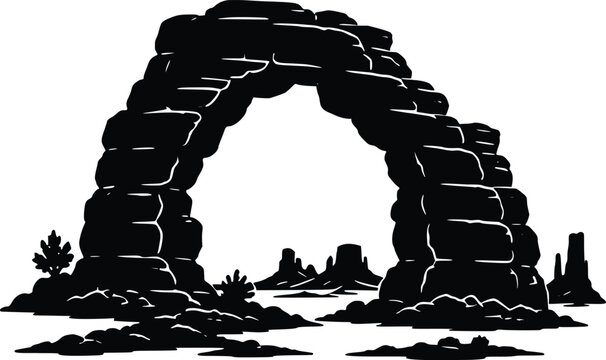 Beautiful natural stone arch surrounded by desert landscape featuring bushes and distant rock formations