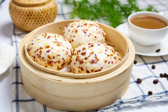 Three colorful crispy crumb coated steamed buns white plate grid tablecloth