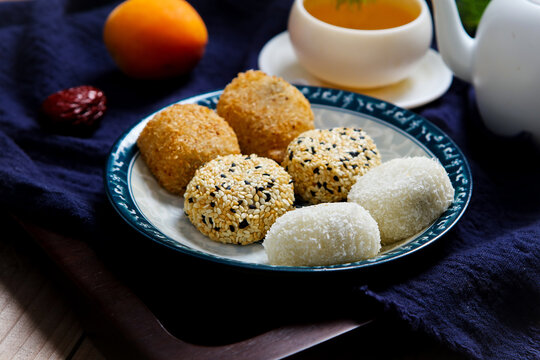 Assorted glutinous rice mochi coconut sesame coated square ceramic plate