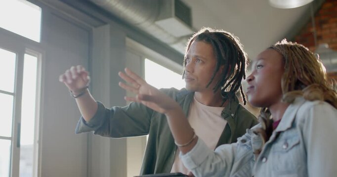 African American colleagues spotting tall windows, pointing, holding tablet, discussing layout