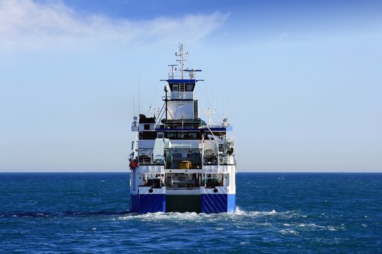 Trauler fishing boat sailing along the Mediterranean coast of Spain. 