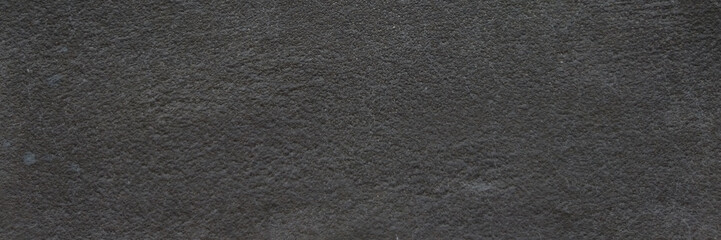 Dark charcoal felt texture background, seamless black wool fabric surface, soft matte textile material for fashion and interior design backdrops © Arbaz