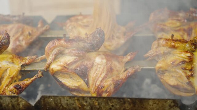 Close-Up of Applying Sauce to Grilled Chicken with Basting Mop