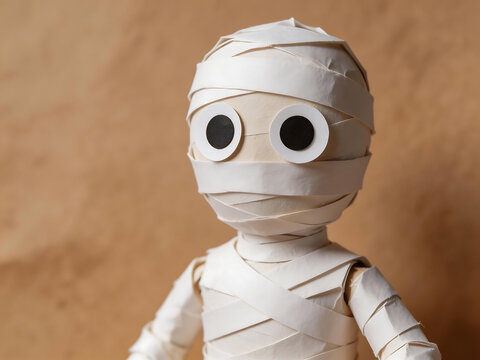 Paper mummy figure with googly eyes