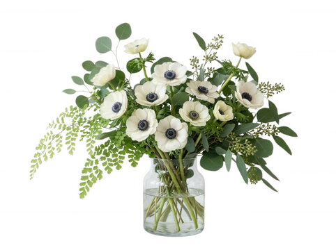Bouquet of white anemones and eucalyptus in glass vase isolated