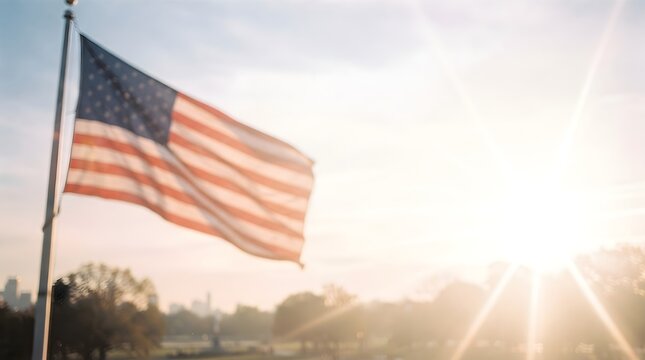 American flag waving against a bright sunset sky for labor day celebration and national patriotic holiday