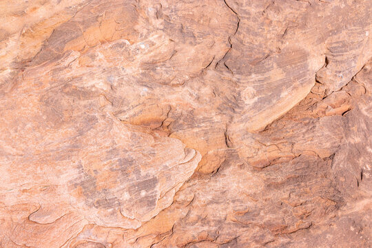 Close up view of natural red sandstone rock texture and surface pattern