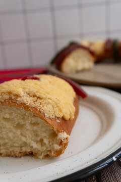 As you approach the interior of "Rosca de Reyes" or Epiphany bread, in the background you can see more bread