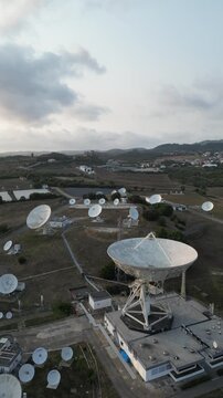 Aerial view of satellite dish antennas at a rural ground station
