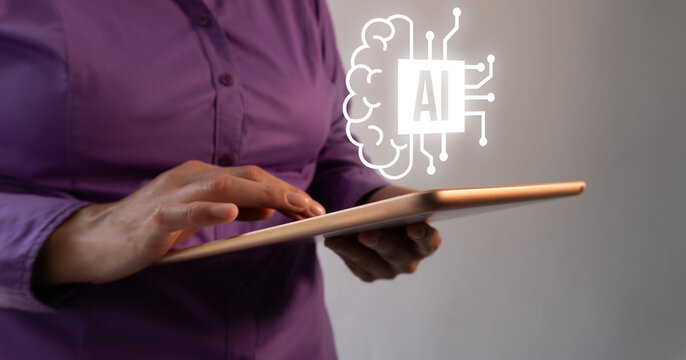 Person holds tablet with glowing AI symbol above. Fingers tap screen, suggesting digital interaction. Abstract icon pulses softly, symbolizing smart technology