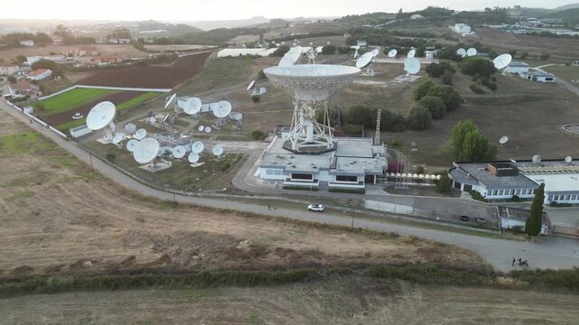 Aerial view of satellite dish antennas at a rural ground station
