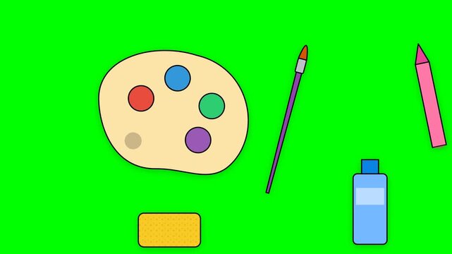 Art supplies on a green screen background for creative projects.