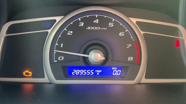 Car instrument panel with active check engine warning light