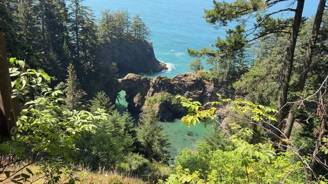 Natural Bridges in Brookings, Oregon, as seen from scenic viewpoint, on a summer day.