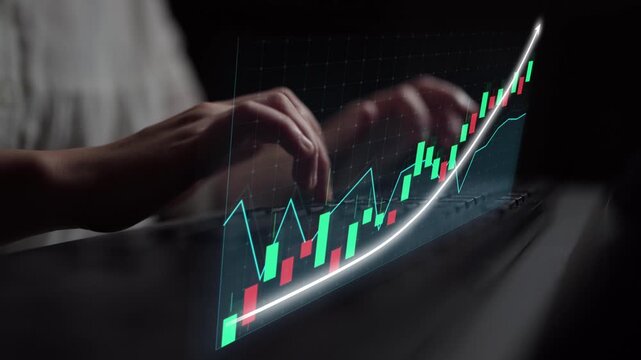 A close-up view of hands typing on a keyboard with an overlay of a financial graph, illustrating stock market growth and analysis in a modern workspace setting. Copula