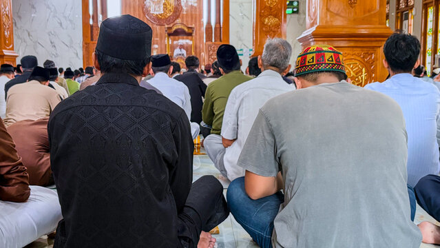 Rear View of Muslim Congregation During Friday Sermon in Mosque