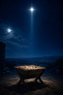 A nativity scene with empty manger and a bright star at night with Christmas concept