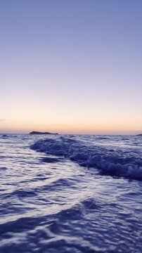 Low Angle View of Ocean Waves at Sunset