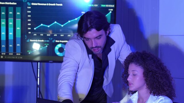 Business professionals collaborating in a modern office, analyzing digital dashboards and financial data, discussing market trends, business performance, data visualization, strategic planning.