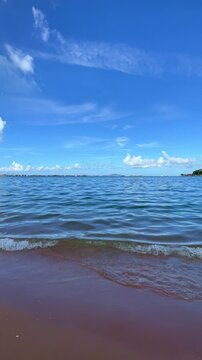 High-quality vertical beach footage capturing tropical paradise with clear water, natural sunlight, and pristine coastline. Ideal for tourism marketing, social media content, travel agencies, and dest