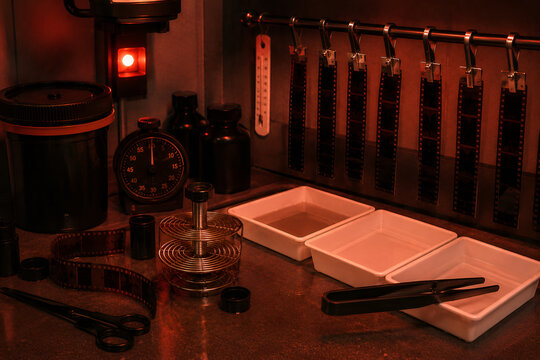 Traditional Film Developing Darkroom with Processing Equipment. Red safelight