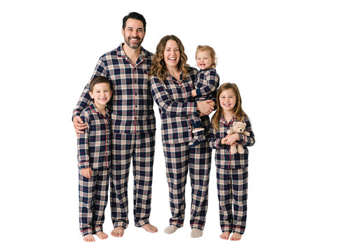 Happy family of five wearing matching plaid pajamas standing together transparent background