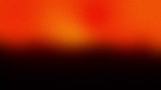 Vibrant orange and black gradient abstract background with a subtle grainy texture